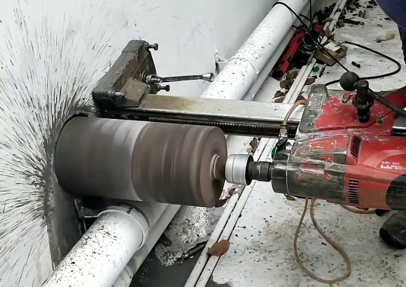 Concrete core cutting machine in operation